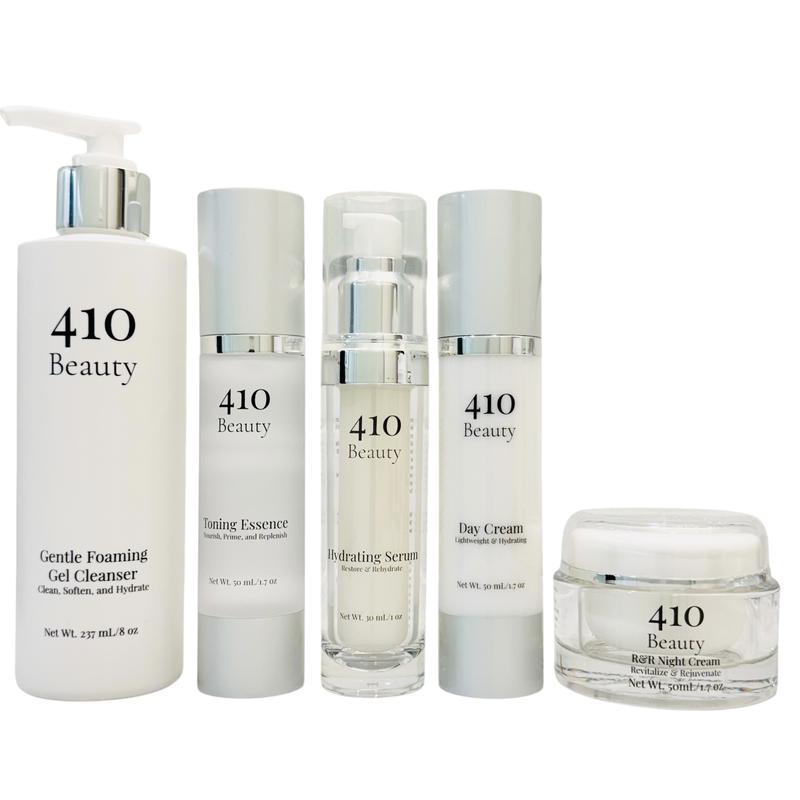 410 Beauty Essentials Bundle- Includes a 237mL bottle of our Gentle Foaming Gel Cleanser, a 50mL bottle of our Toning Essence, a 30mL bottle of our Hydrating Serum, a 50mL bottle of our Day Cream, and a 50mL jar of our R&R Night Cream