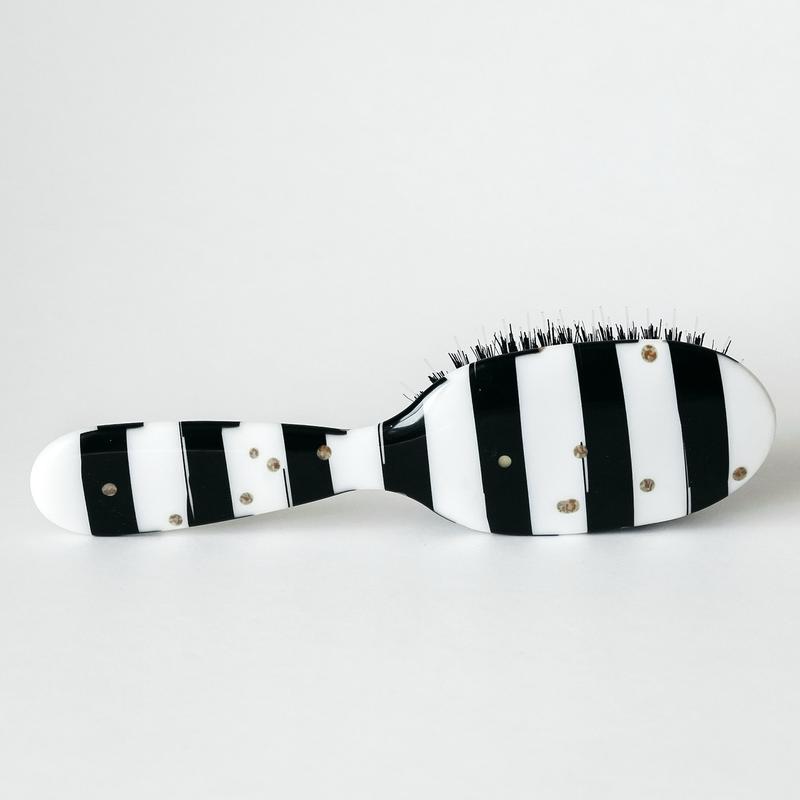 Hairbrush black and white gold dots, boar bristle. Removable brush pad. Slides through tangles great hair care brush!